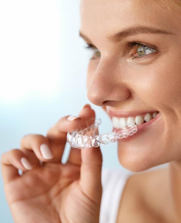 Smiling patient representing orthodontic treatment at Dental Perfection